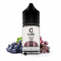 A clear glass bottle of core salt vape liquid by dinner lady grape vine flavor with black cap and white label